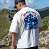 Man wearing oversized organic cotton T-shirt with mountain and sea print "No Service No Problem"