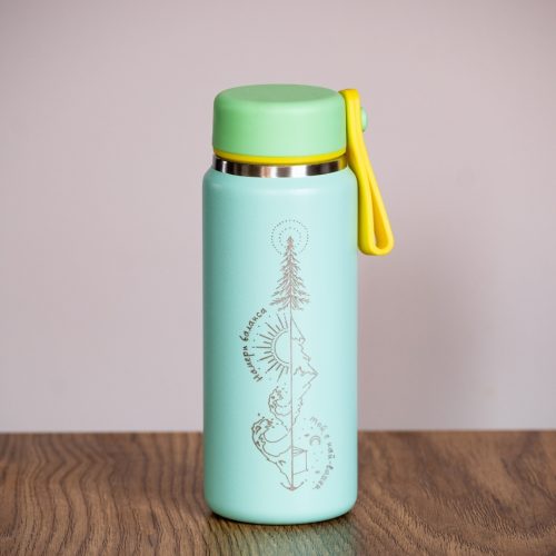 Mint green 200ml mini thermos with laser-engraved mountain design and yellow handle.
