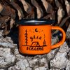 Small orange enamel mug with camping illustration, tent, and text “My Universe”, placed outdoors on bark.