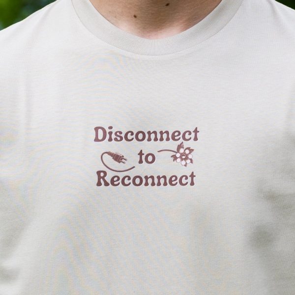 Close-up front print on organic cotton t-shirt with Disconnect to Reconnect message