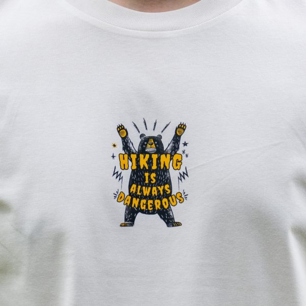 Close-up front print on white organic cotton hiking t-shirt with bear graphic