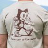 Close-up back graphic on organic cotton t-shirt featuring hiking cat and Disconnect to Reconnect message