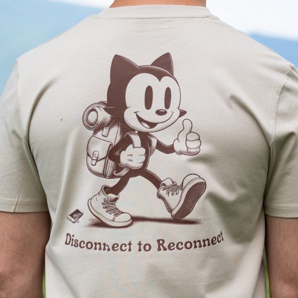 Close-up back graphic on organic cotton t-shirt featuring hiking cat and Disconnect to Reconnect message