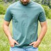 Front view of green organic cotton t-shirt with Faith Can Move Mountains chest print