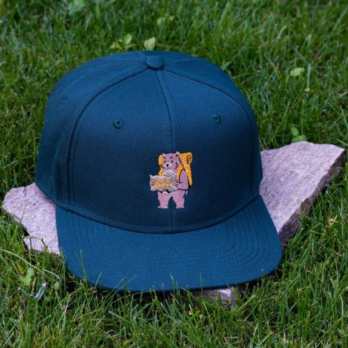 Front view of dark green flat brim cap made from 100% recycled micro twill with embroidered hiking bear