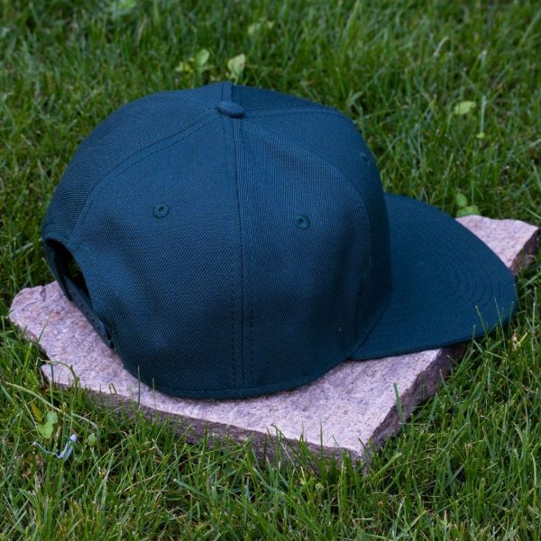 Back view of dark green flat brim cap made from 100% recycled micro twill with adjustable snapback closure