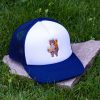 Front view of white and navy blue kids mesh cap made from durable material with embroidered hiking bear carrying a backpack.