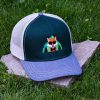 Front view of green trucker cap made from 50% organic and 50% recycled cotton with soft mesh back and embroidered fox wearing sunglasses