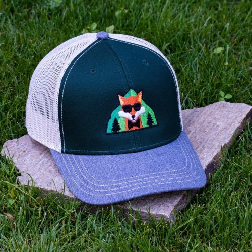 Front view of green trucker cap made from 50% organic and 50% recycled cotton with soft mesh back and embroidered fox wearing sunglasses