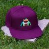 Front view of burgundy flat brim cap made from 100% recycled micro twill with embroidered fox wearing sunglasses