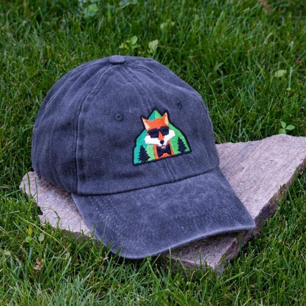 Black vintage cotton baseball cap with embroidered fox wearing sunglasses, washed finish and adjustable Velcro strap