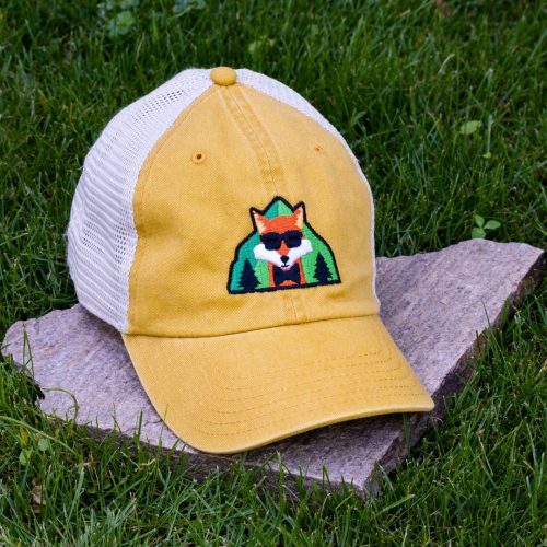 Yellow trucker cap made from organic and recycled cotton with embroidered fox, soft mesh back and adjustable closure