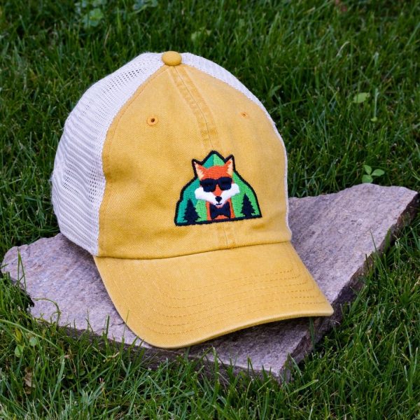 Yellow trucker cap made from organic and recycled cotton with embroidered fox, soft mesh back and adjustable closure