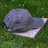 Back view of grey vintage organic cotton baseball cap with adjustable metal buckle, washed finish and curved visor