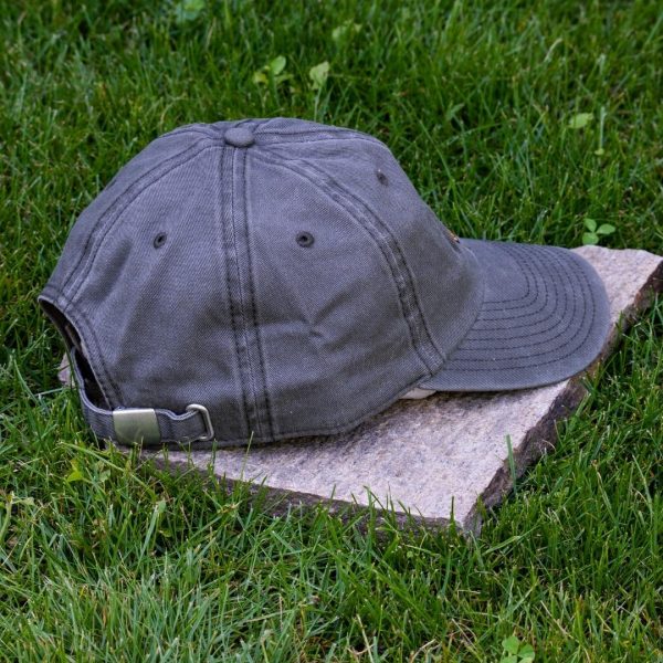 Back view of grey vintage organic cotton baseball cap with adjustable metal buckle, washed finish and curved visor