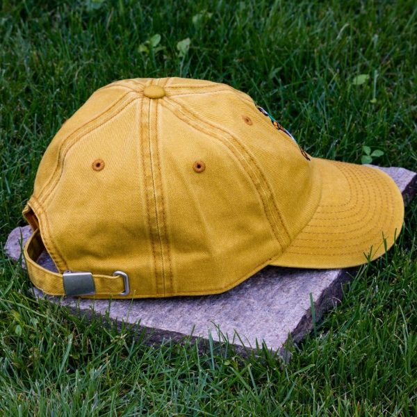 Back view of yellow vintage organic cotton baseball cap with adjustable metal buckle, washed finish and curved visor