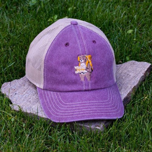 Purple trucker cap made from organic and recycled cotton with embroidered hiking bear, soft mesh back and adjustable closure